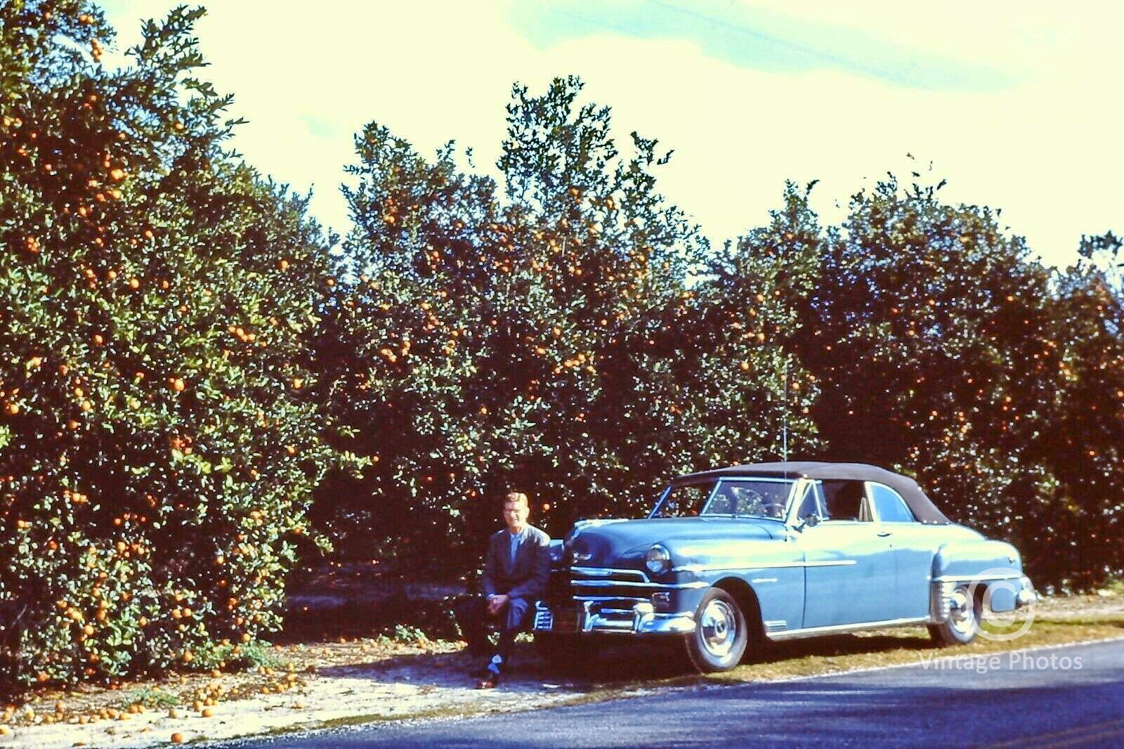 1950s Light Blue Convertible plus man