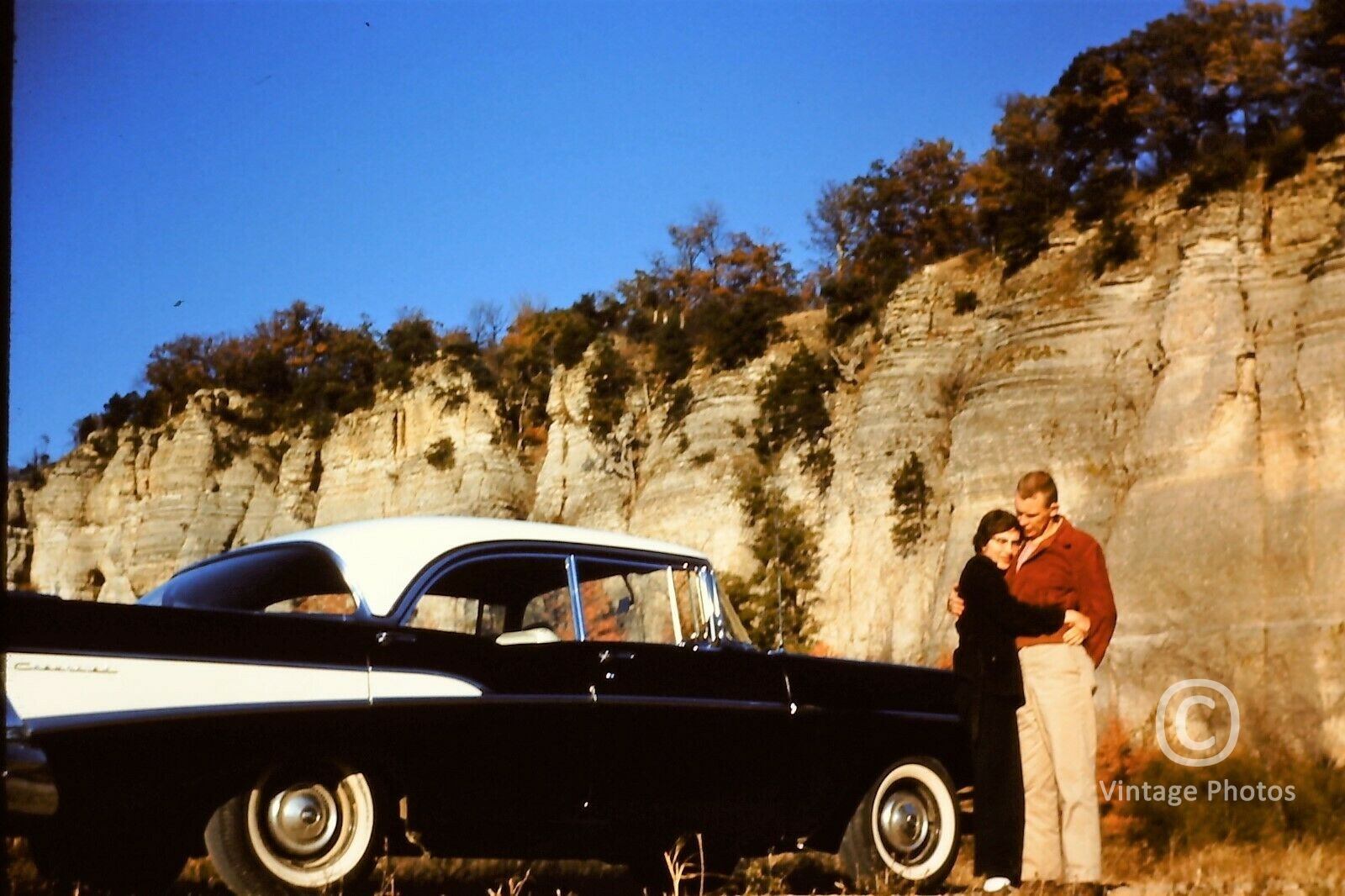 1950s Classic American Coupe Car with hugging couple